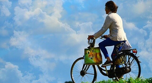 Woman riding a bike.